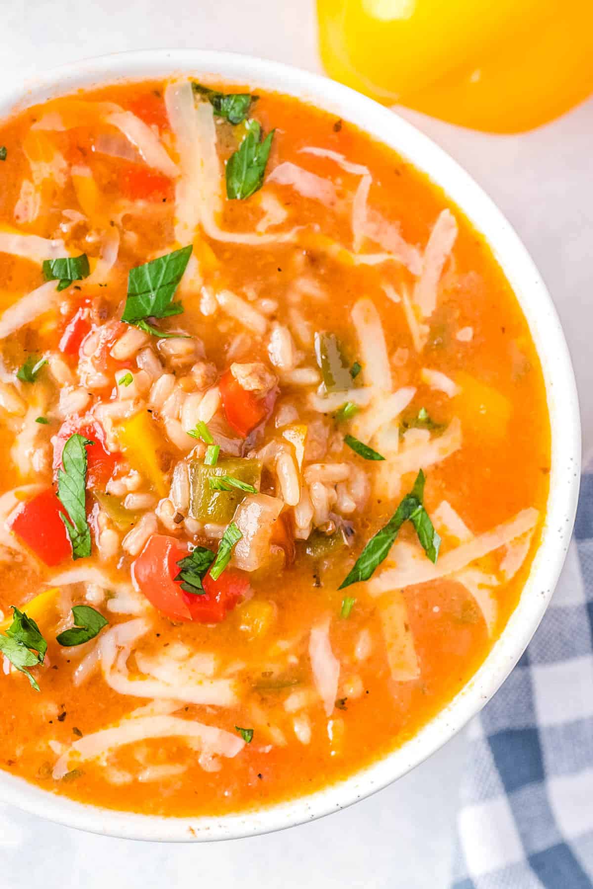 A close up picture of the finished Instant Pot Stuffed Pepper Soup in a white bowl.