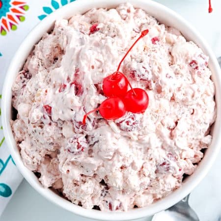 An overhead picture of the finished Cherry Fluff Salad in a white serving bowl.