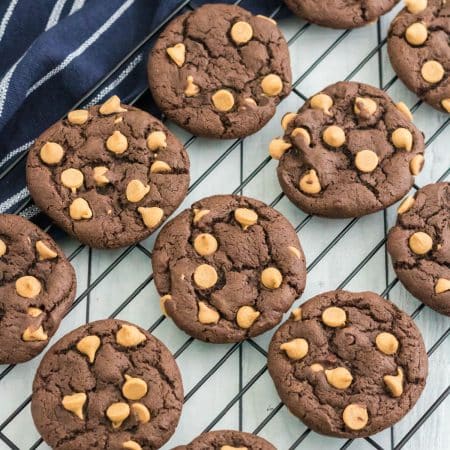 An overhead picture of the finished Chocolate Peanut Butter Chip Cookies on a wire rack.