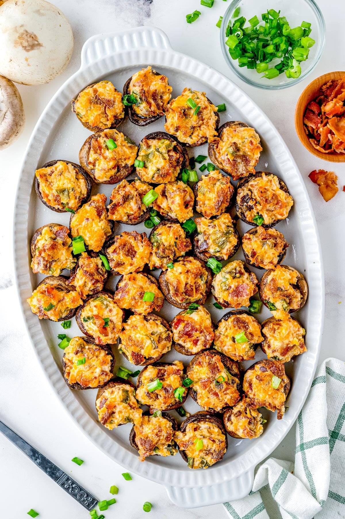 An overhead picture of the finished Bacon Stuffed Mushrooms on a serving platter.