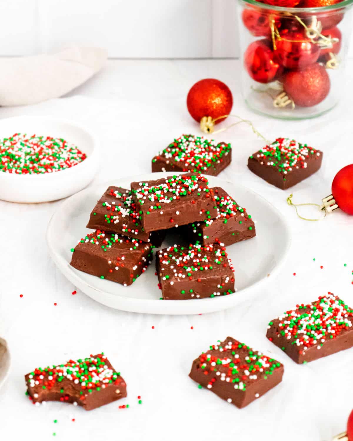 a plate of fudge with more slices around the plate