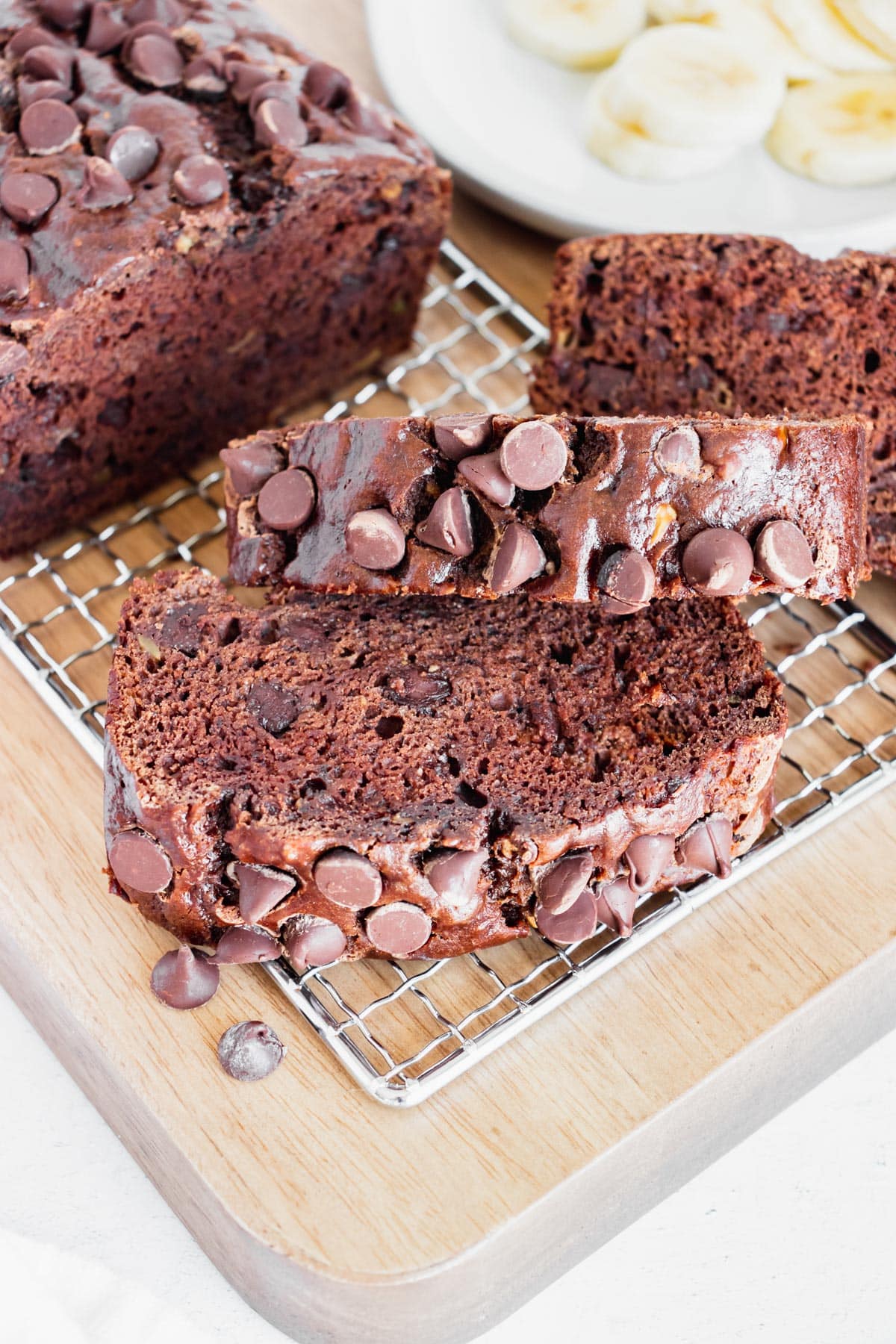 Slices of the Double Chocolate Banana Bread recipe on a wire rack.