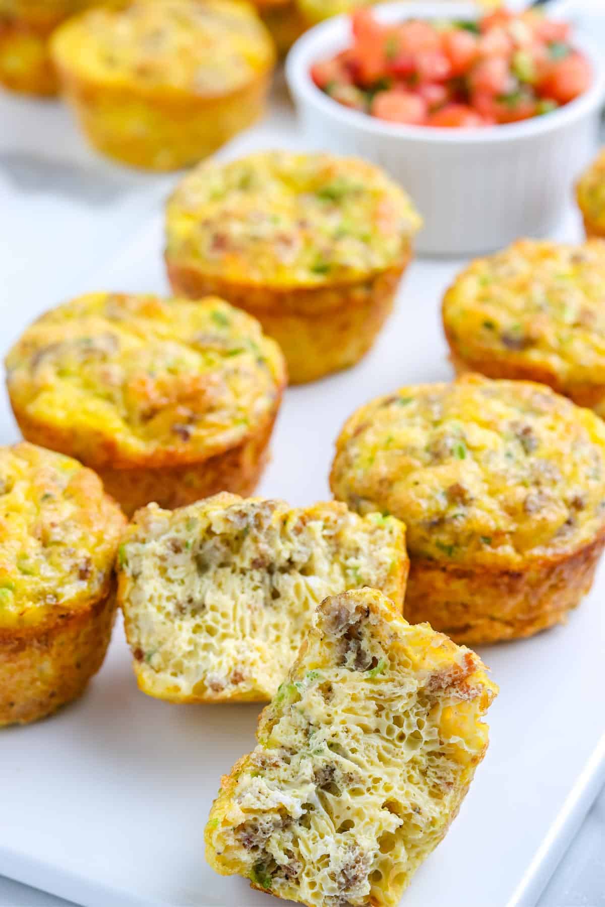 A close up picture of a finished egg muffin cup cut in half so you can see the interior of it.