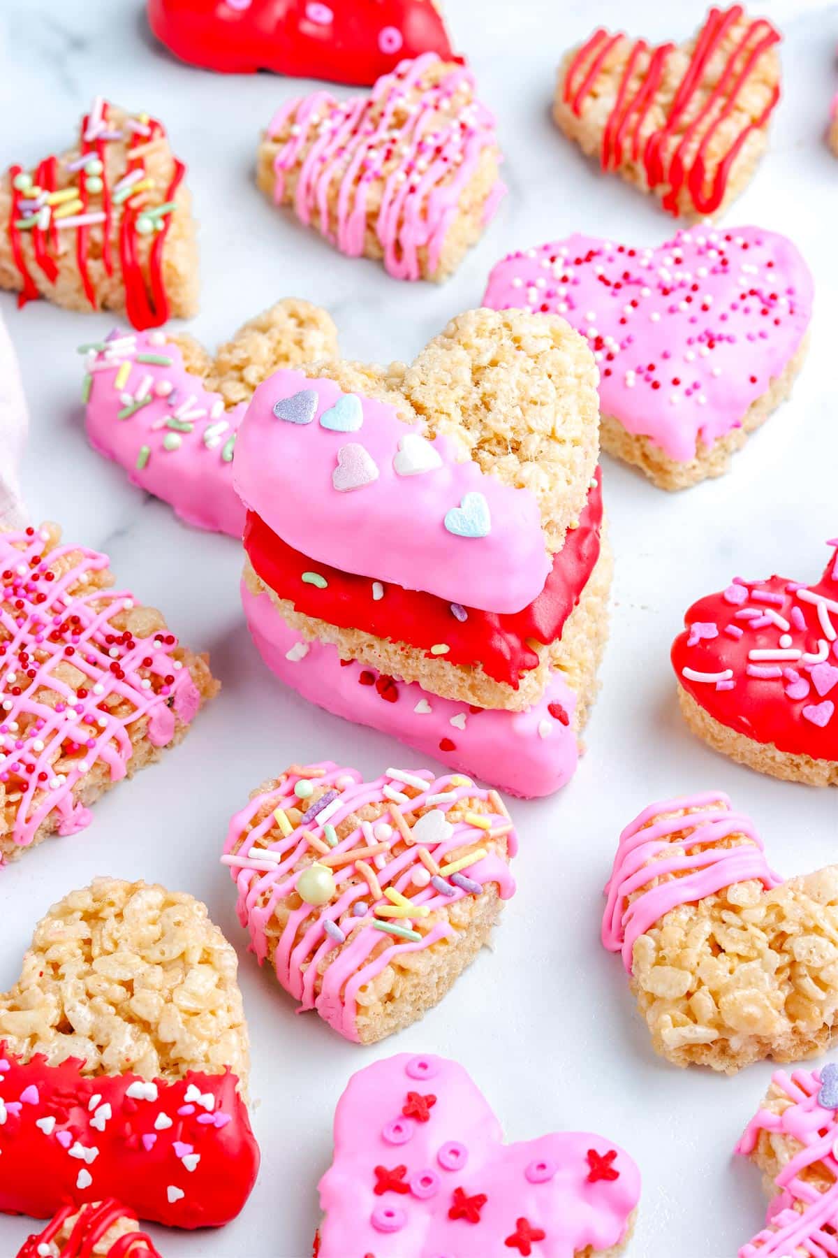 Three of the Heart Shaped Rice Krispie Treats stacked on top of each other.