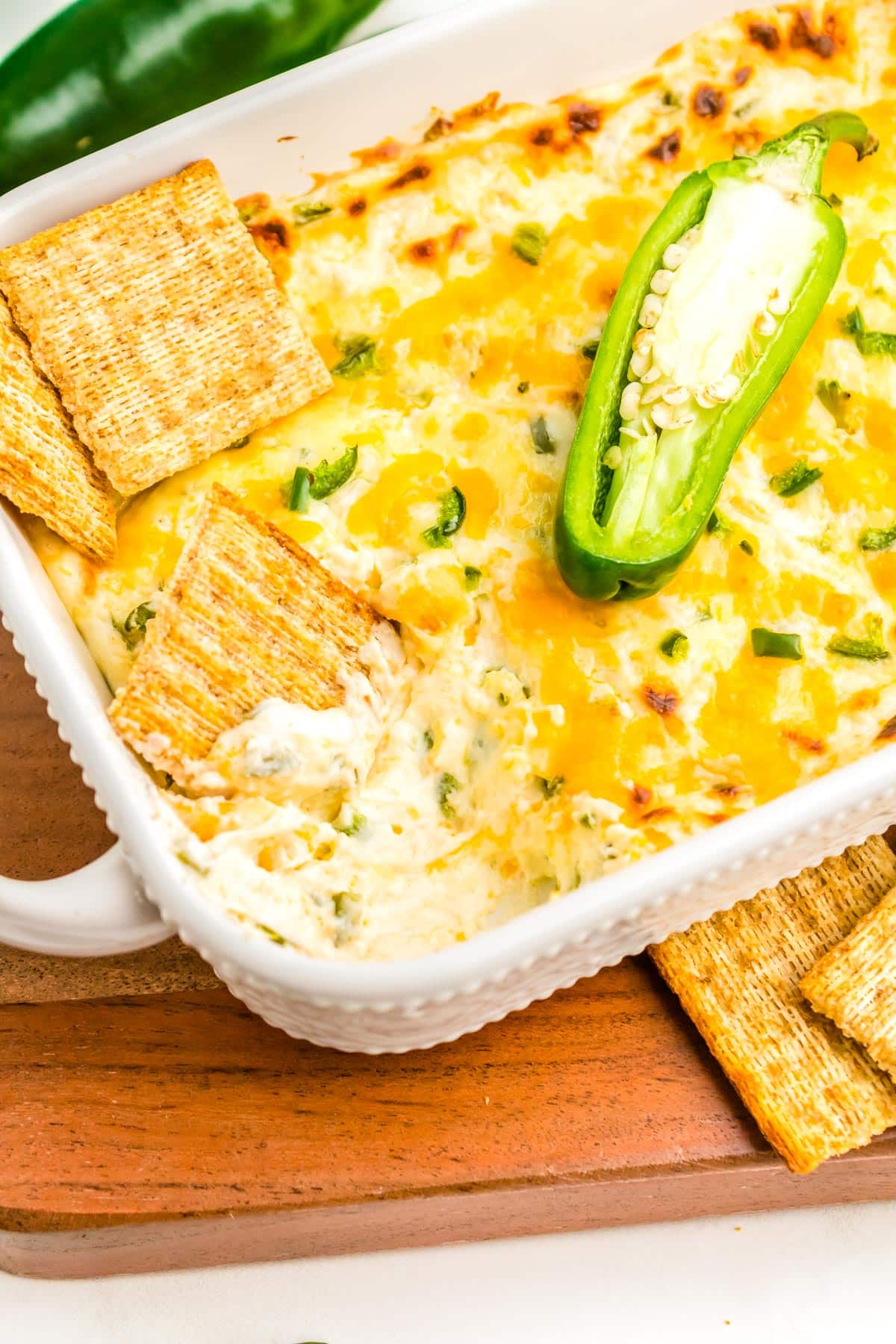 The finished Jalapeno Cheese Dip in a white baking dish.