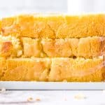 A close up picture of the finished Lemon Bread recipe sliced and stacked on each other.