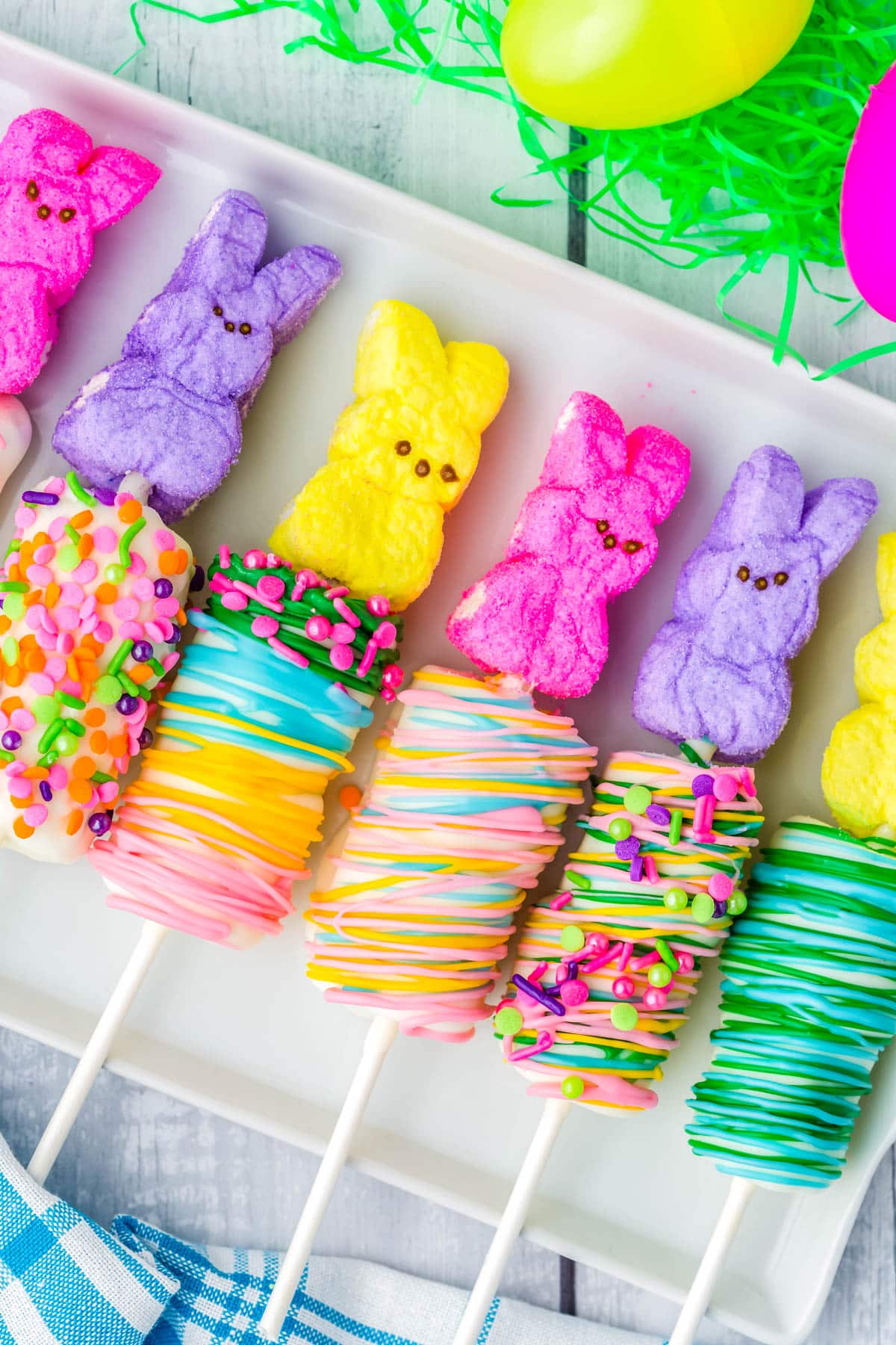 The Easter Marshmallow Pops on a white platter.