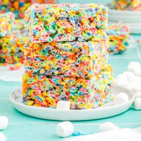 Threes Fruity Pebble Treats stacked on top of each other.