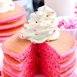 A stack of the Pink Pancakes that have been cut into so you can se what the fluffy interior looks like.