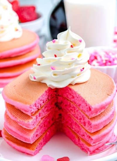 A stack of the Pink Pancakes that have been cut into so you can se what the fluffy interior looks like.