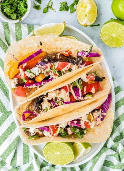 An overhead picture of three Portobello Mushroom Tacos on a platter.