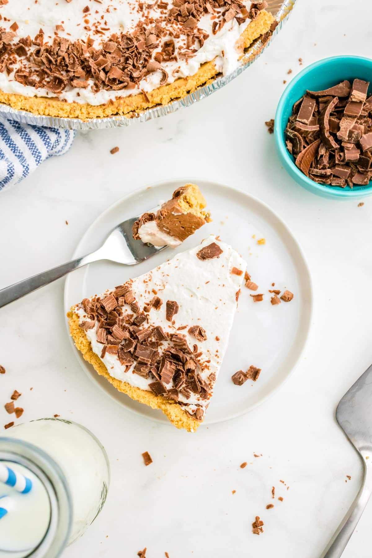 An overhead picture of a slice of Chocolate ilk Pie on a plate with a fork.