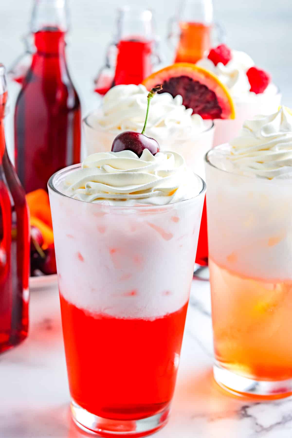 The finished Italian Cream Soda garnished with whipped cream and a cherry.