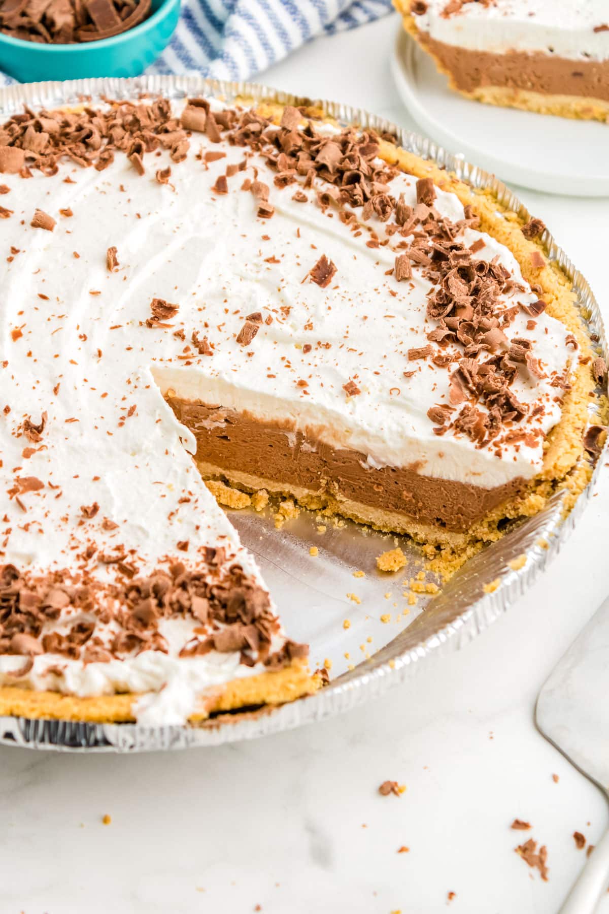 The finished French Silk Pie with a slice cut out of it so you can see the interior of the pie. 