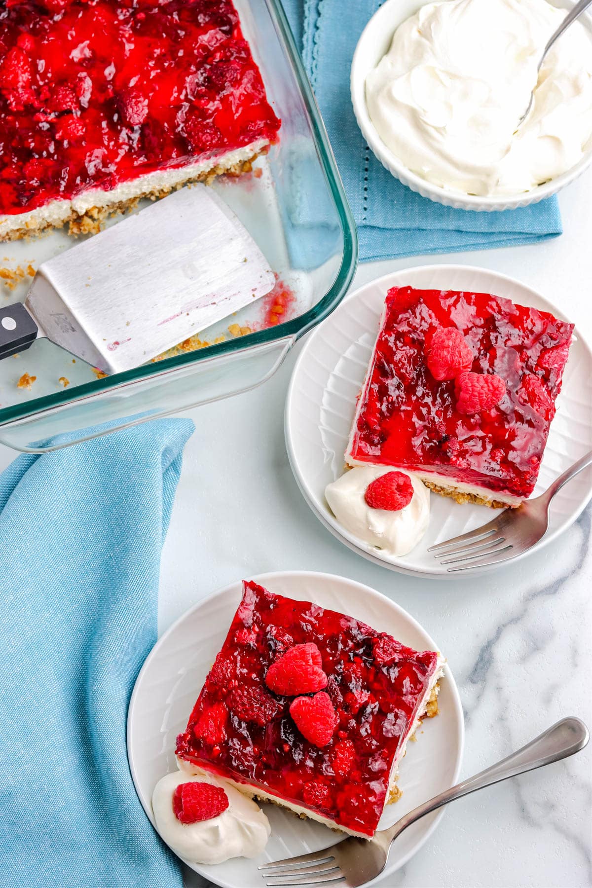 An overhead picture of the finished Raspberry Pretzel Jello Salad on white plates.