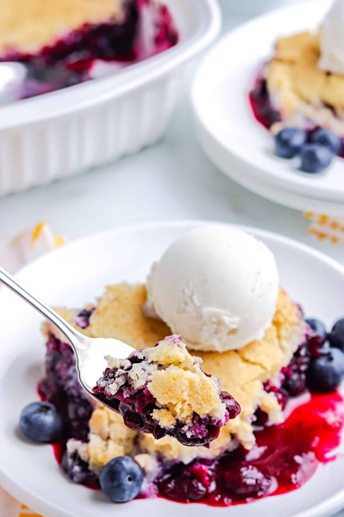 A fork with some of the finished Blueberry Cobbler recipe on it.