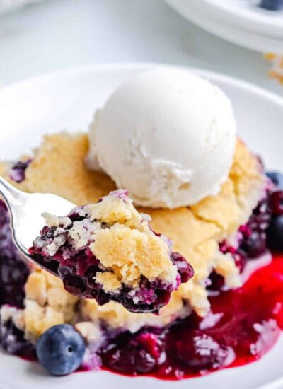 A fork with some of the finished Blueberry Cobbler recipe on it.