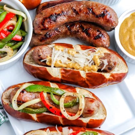 A close up picture of the finished Grilled Brats in rolls.