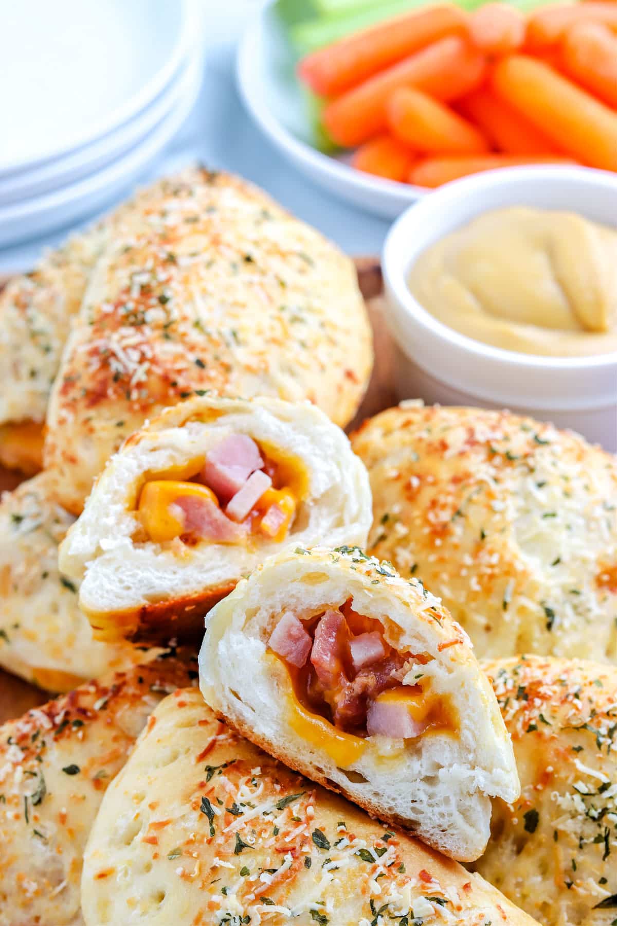 A close up picture of a Homemade Ham and Cheese Hot Pocket cut in half so you can see the interior.