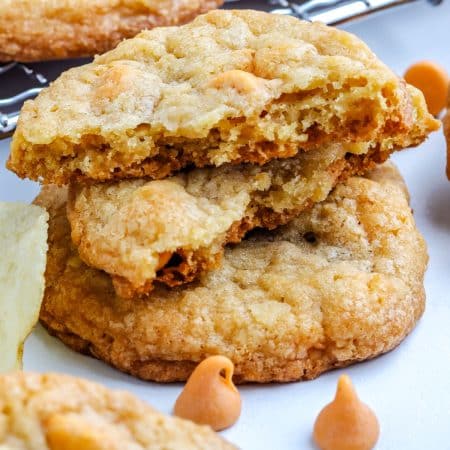 A close up picture of a stack of Potato Chip Cookies and one broken in half.