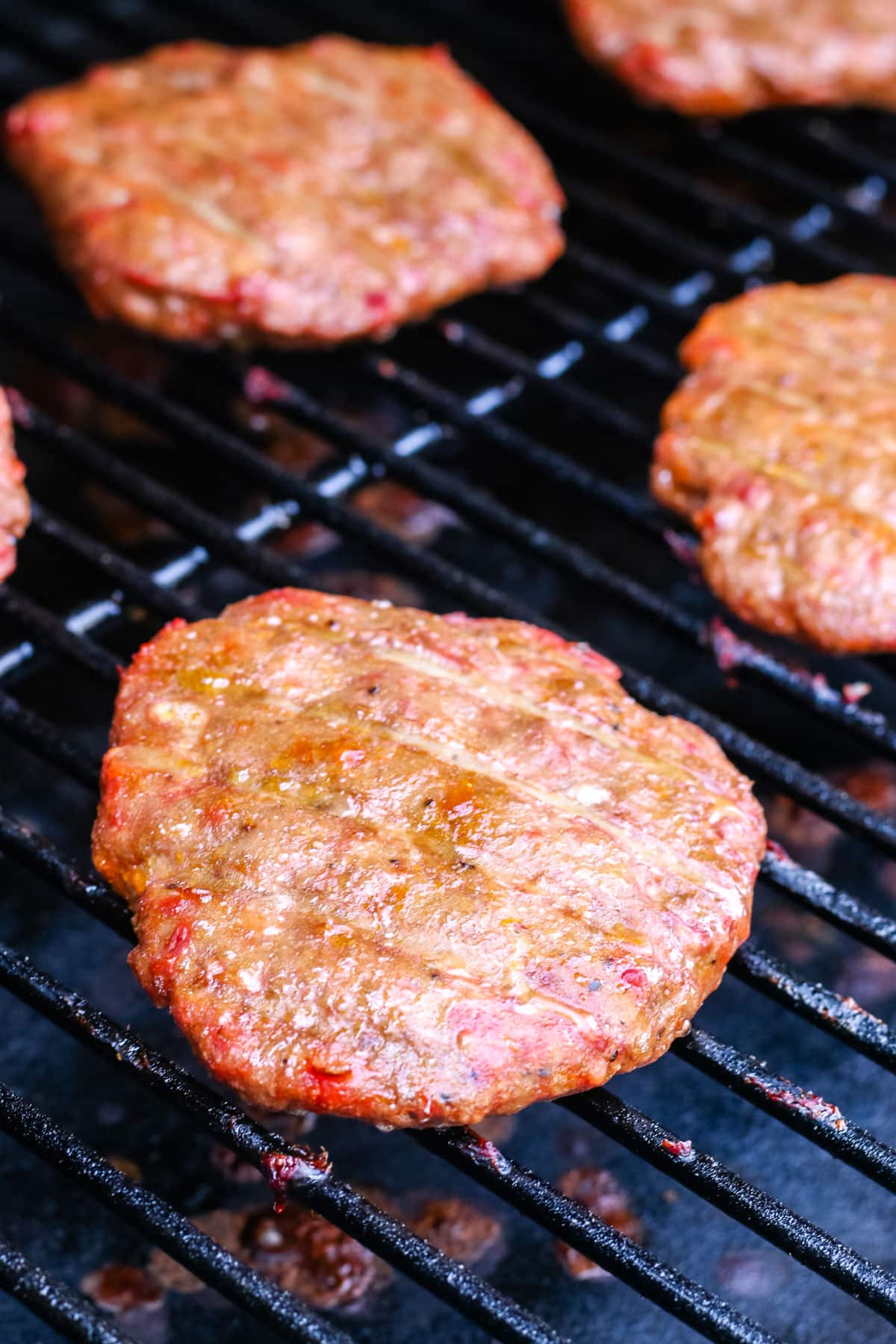 The finished Smoked Turkey Burgers on a Traeger grill.