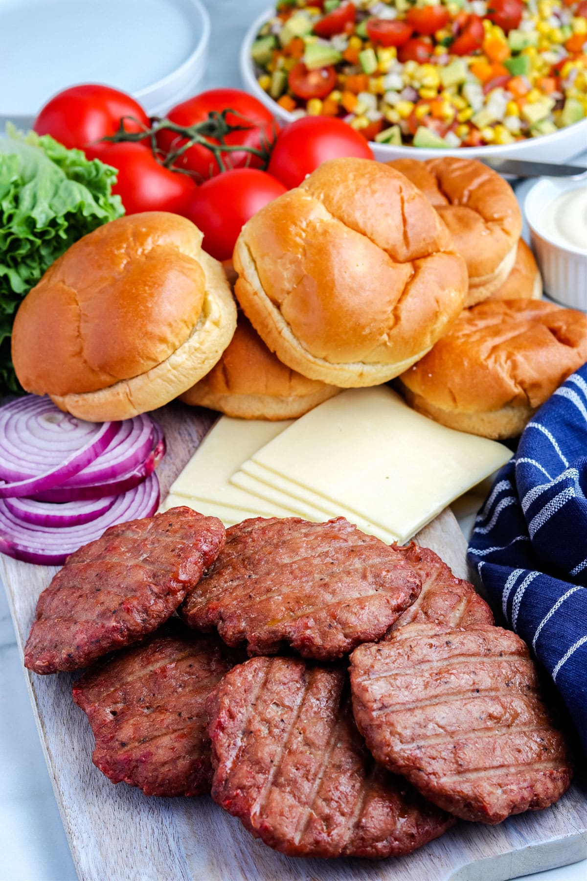 The finished Smoked Turkey Burger patties with the bungs and topping ready to be assembled into sandwiches.