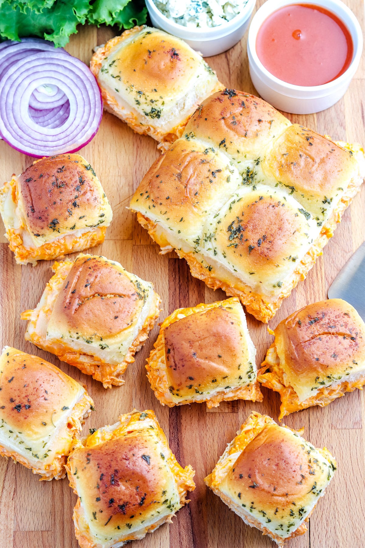 An overhead picture of the finished Buffalo Chicken Sliders that have been cut apart for serving.