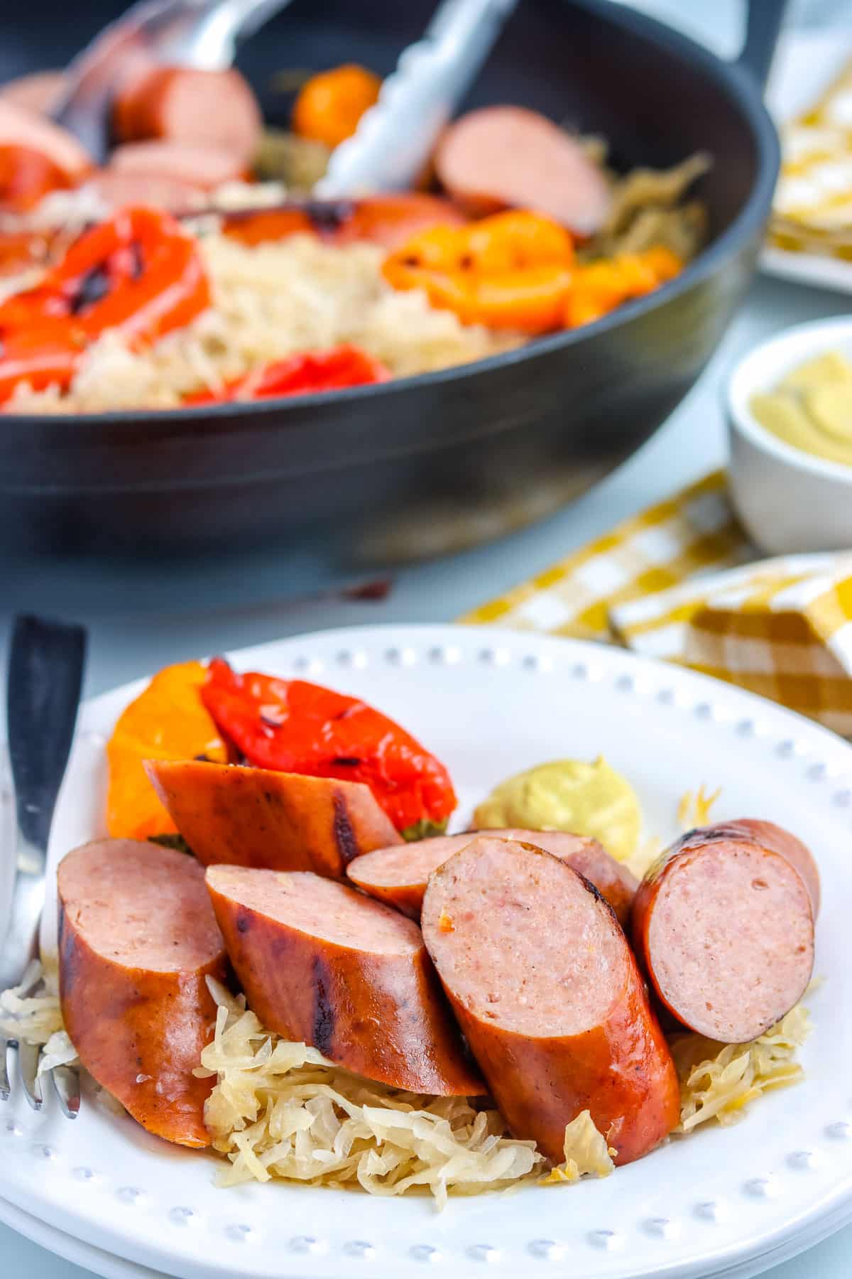 Grilled Kielbasa cut up and on a plate.
