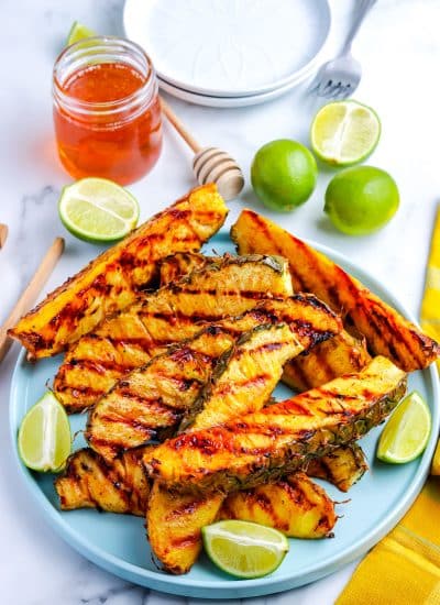 The grilled pineapple on a serving plate.