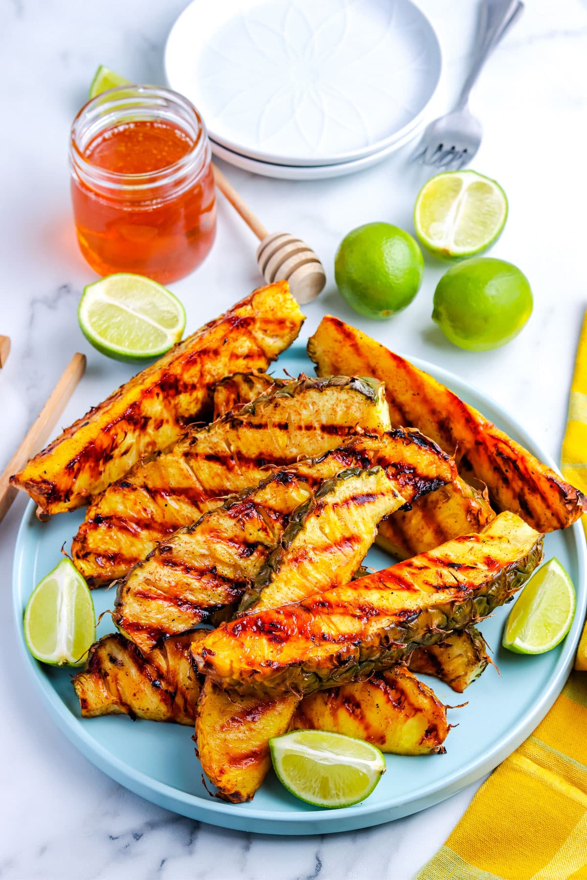 The grilled pineapple on a serving plate.