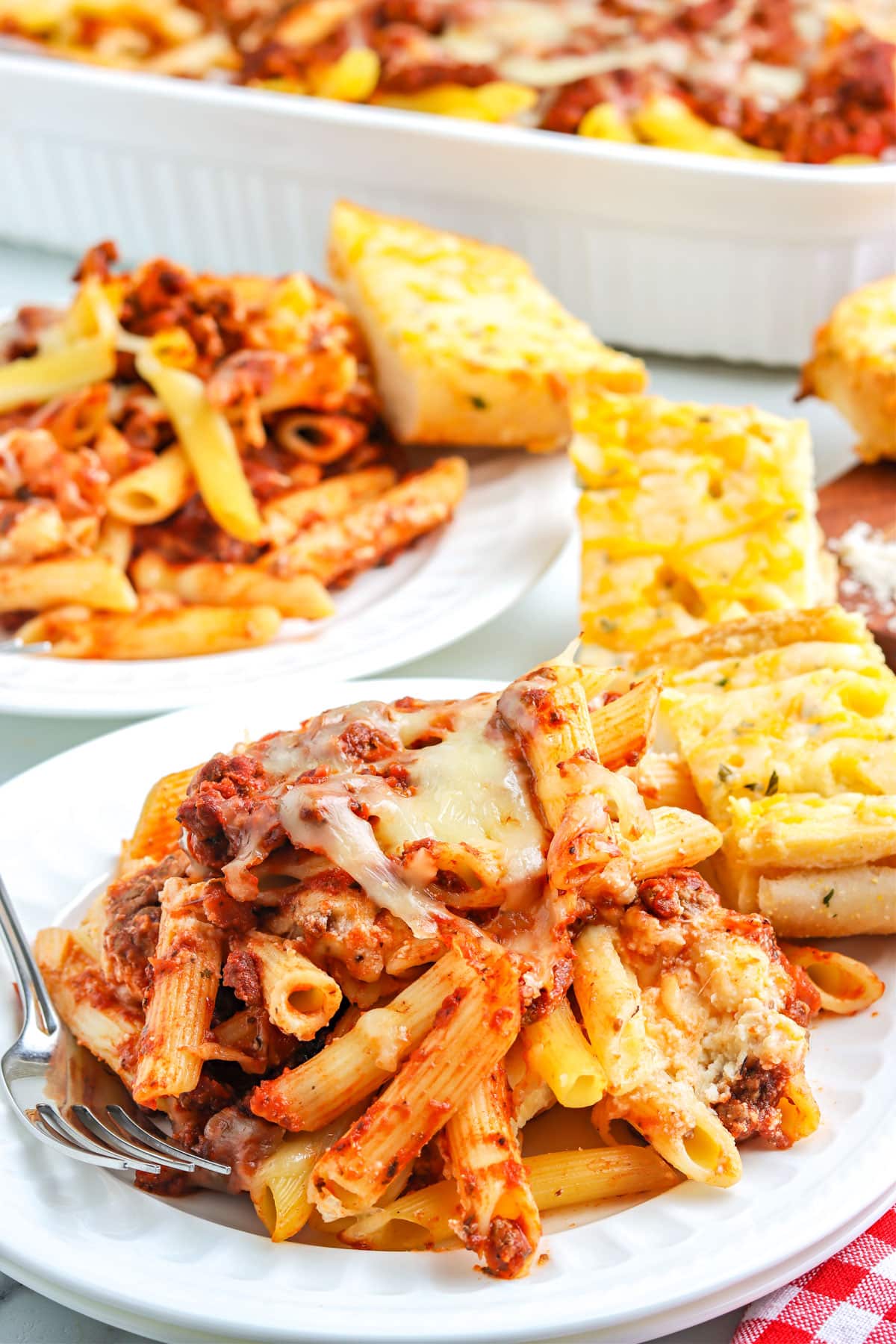 Some of the Baked Penne recipe on a white plate.