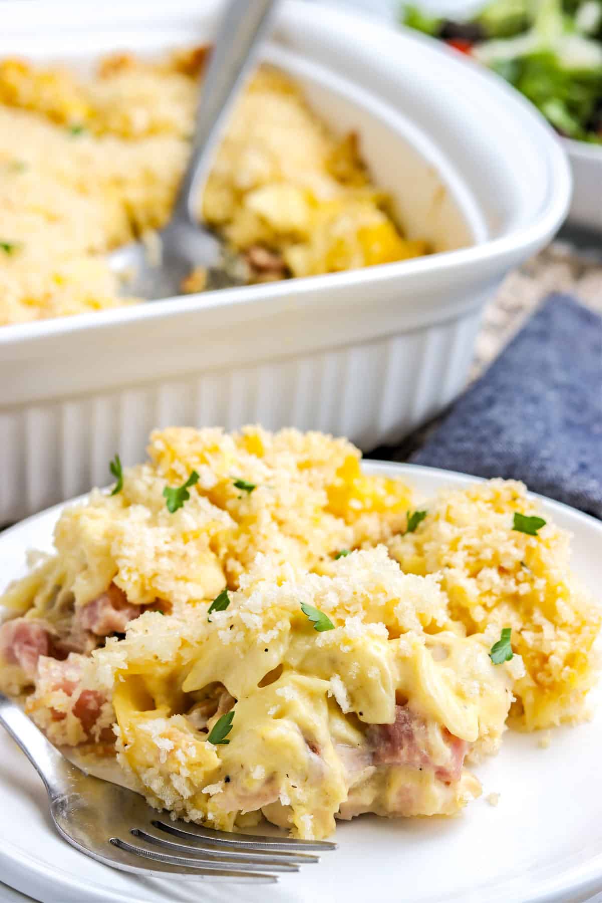 Chicken Cordon Bleu Casserole with pasta on a white plate.