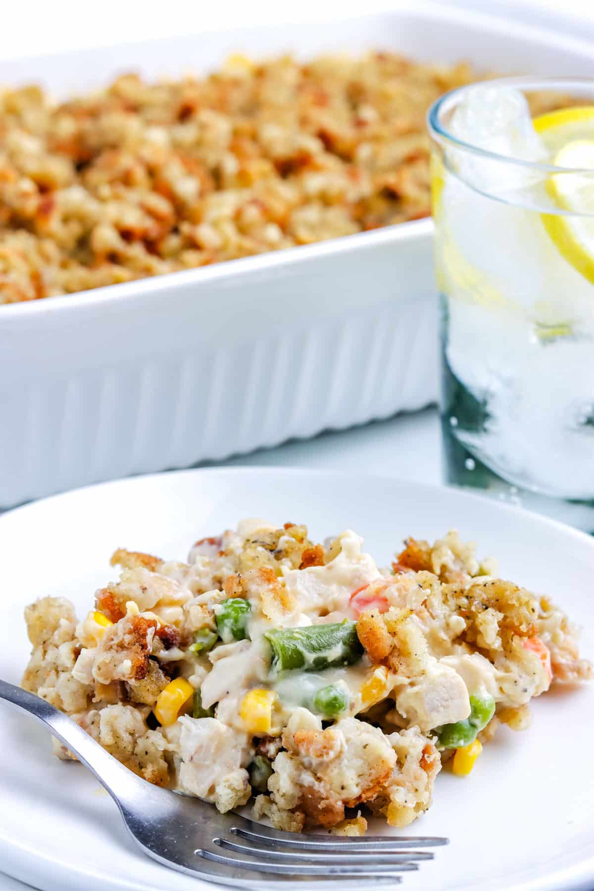 The finished Chicken and Stuffing Casserole on a white serving plate.
