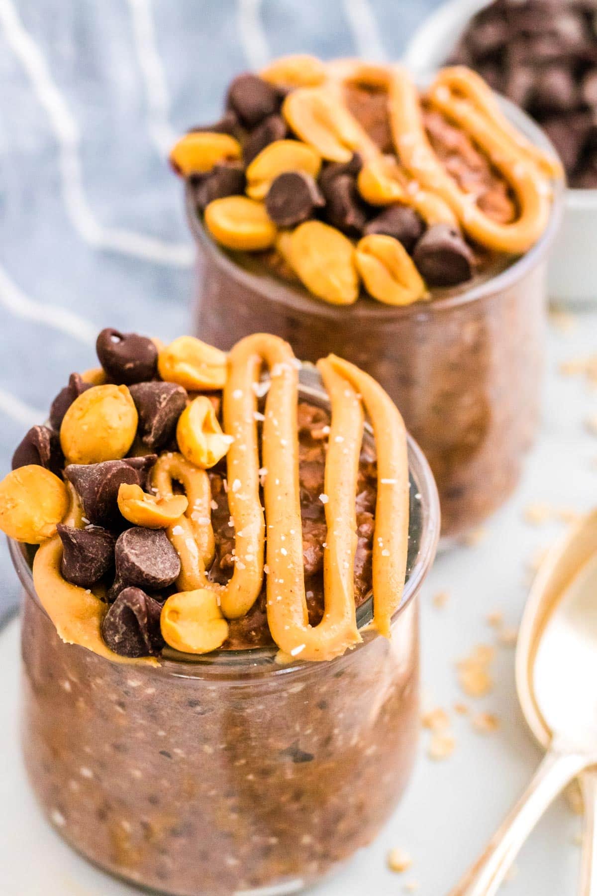 Chocolate Peanut Butter Overnight Oats on small glasses. 