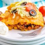A close up of Taco Casserole on a white plate.