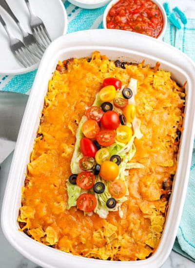 The finished Taco Casserole in a white baking dish.
