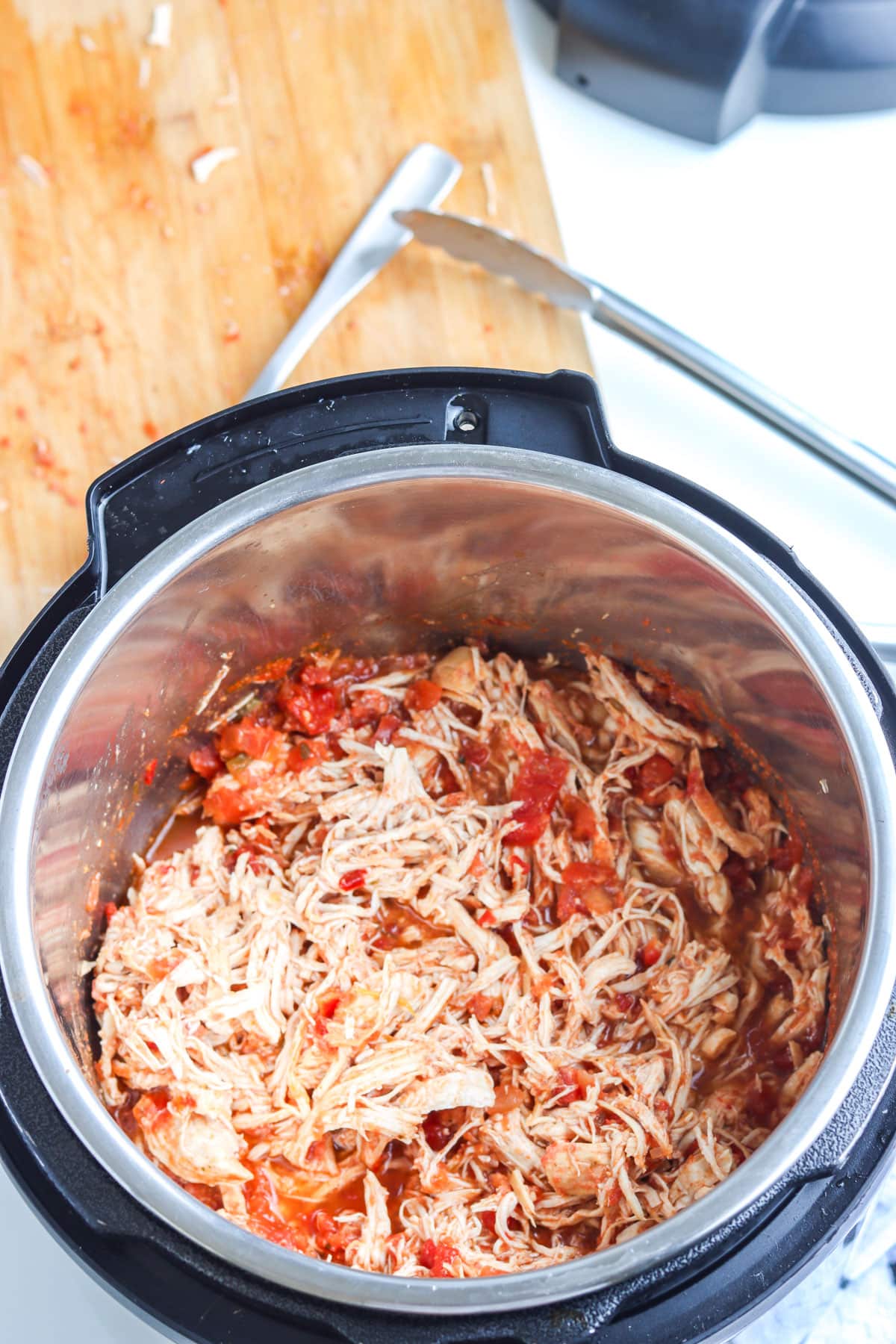 The shredded Salsa Chicken in an Instant Pot.