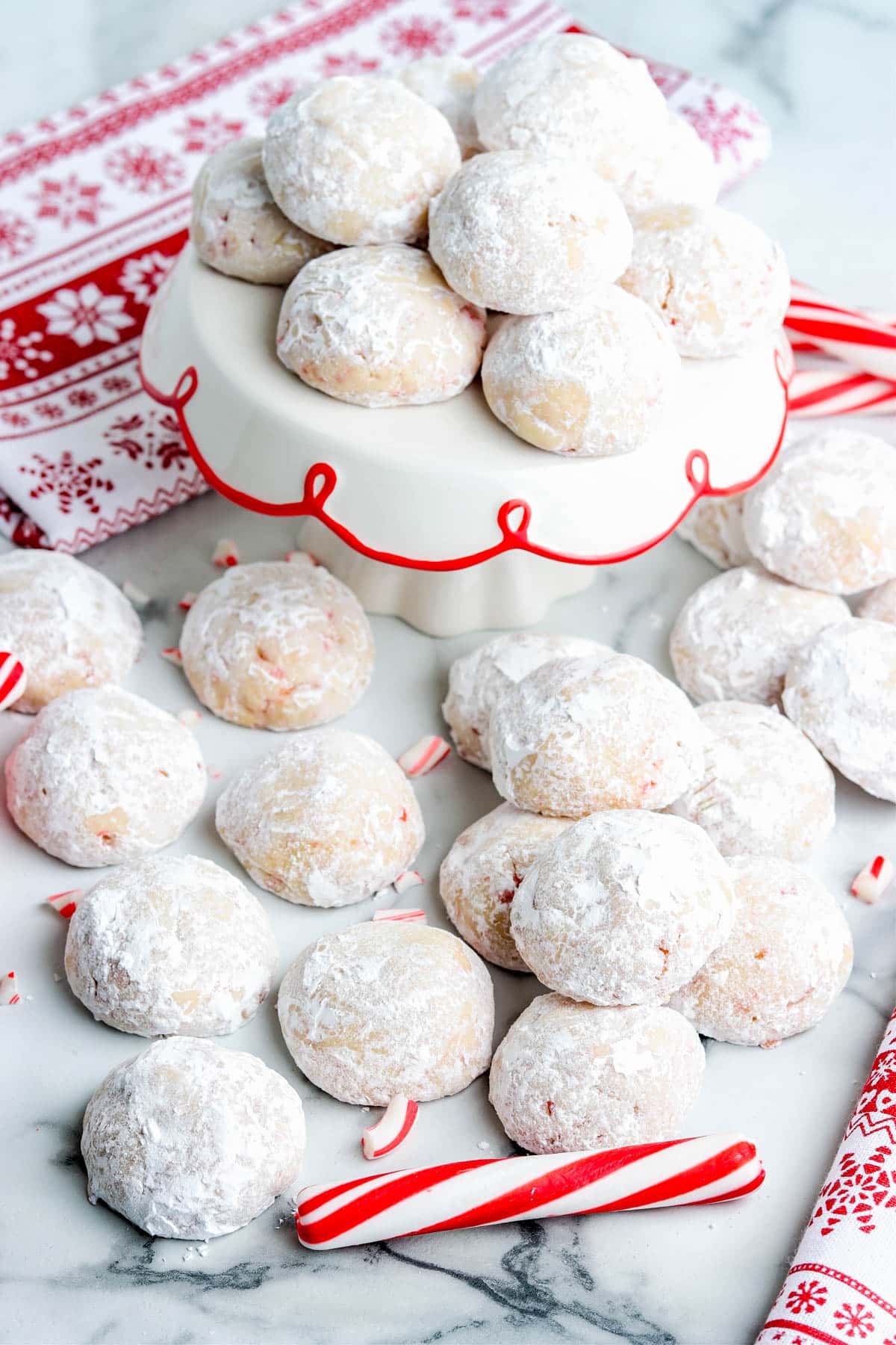 The finished Candy Cane Snowball Cookies on serving platters.