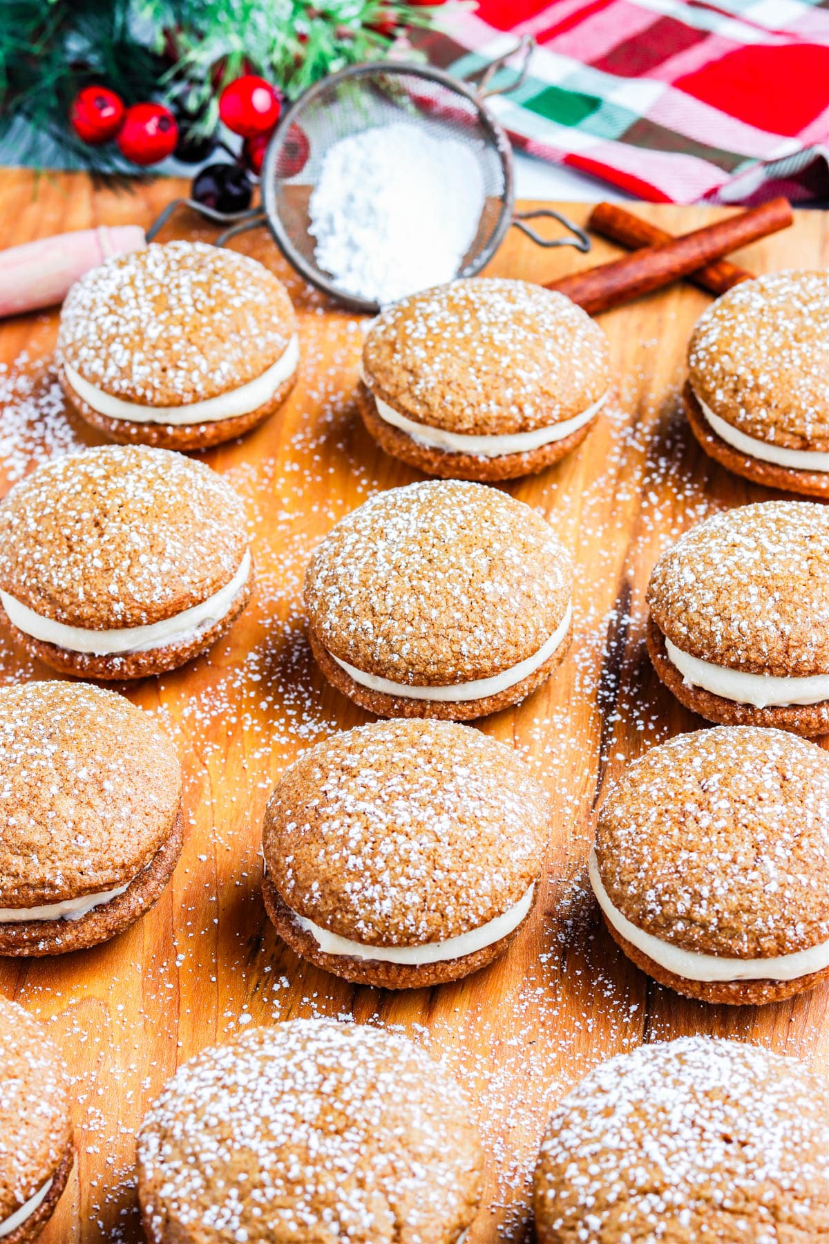 The finished Christmas Whoopie Pies on a wooden serving board.