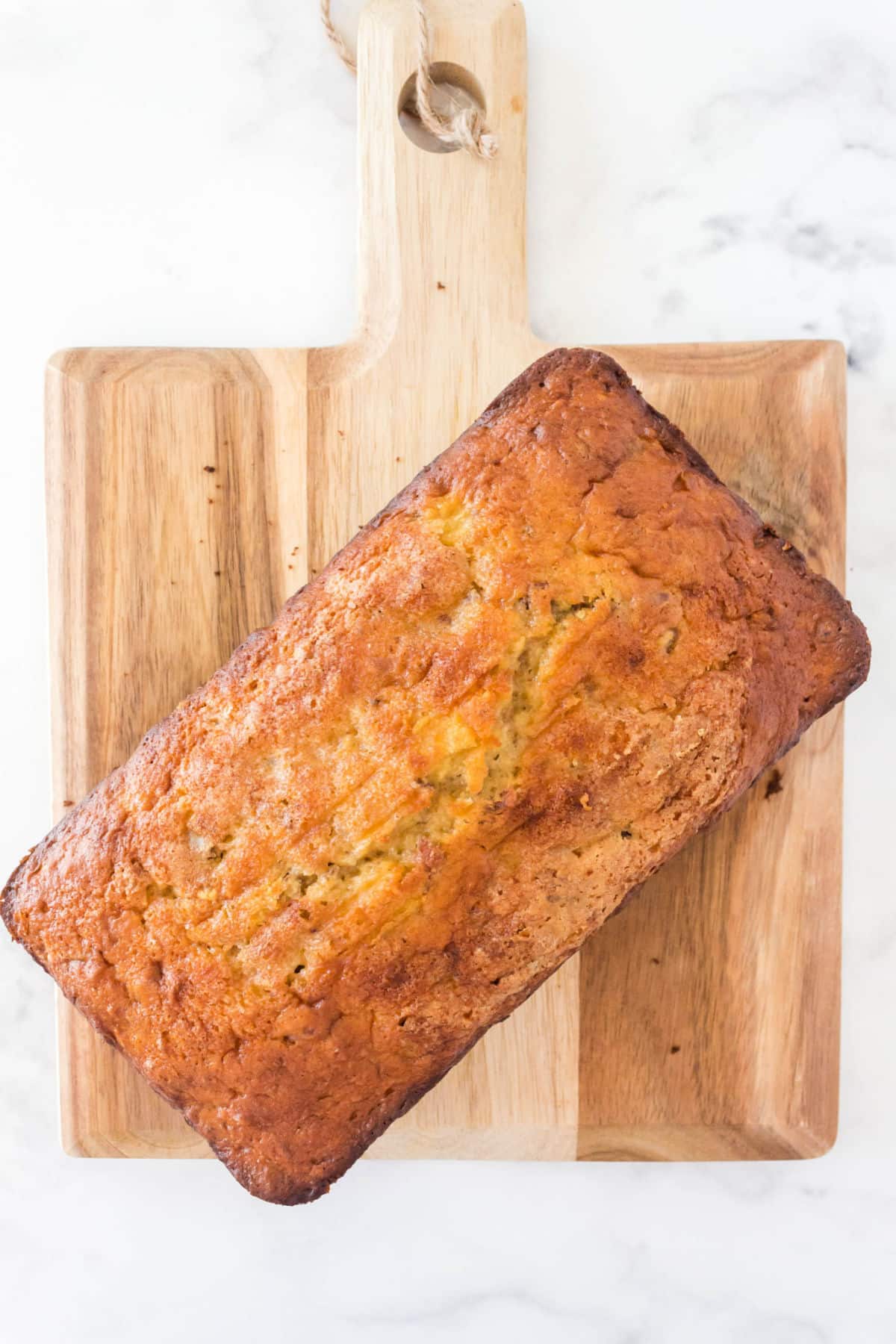 a loaf of banana bread on a cutting board