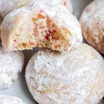A close up picture of a Peppermint Snowball Cookie bit into.