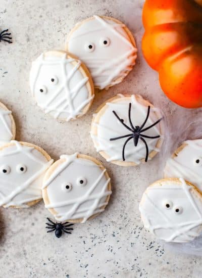 The finished Mummy Halloween Cookies on parchment paper.