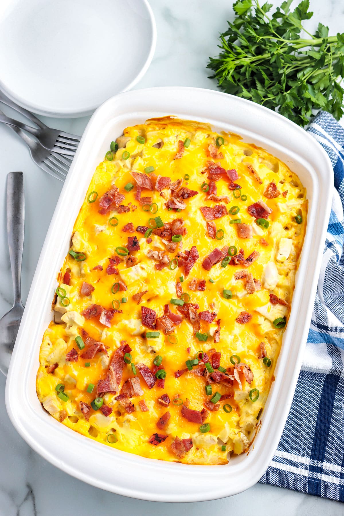 The finished Chicken and Potato Casserole in a white casserole dish.
