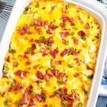 The completely finished Chicken and Potatoes Casserole garnished with bacon and green onion.