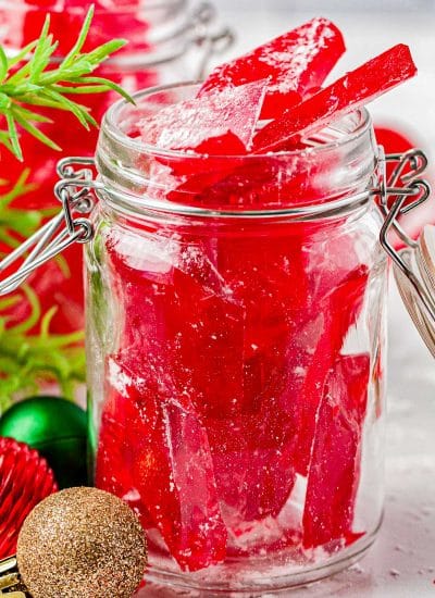 A glass jar filled with Cinnamon Candy.