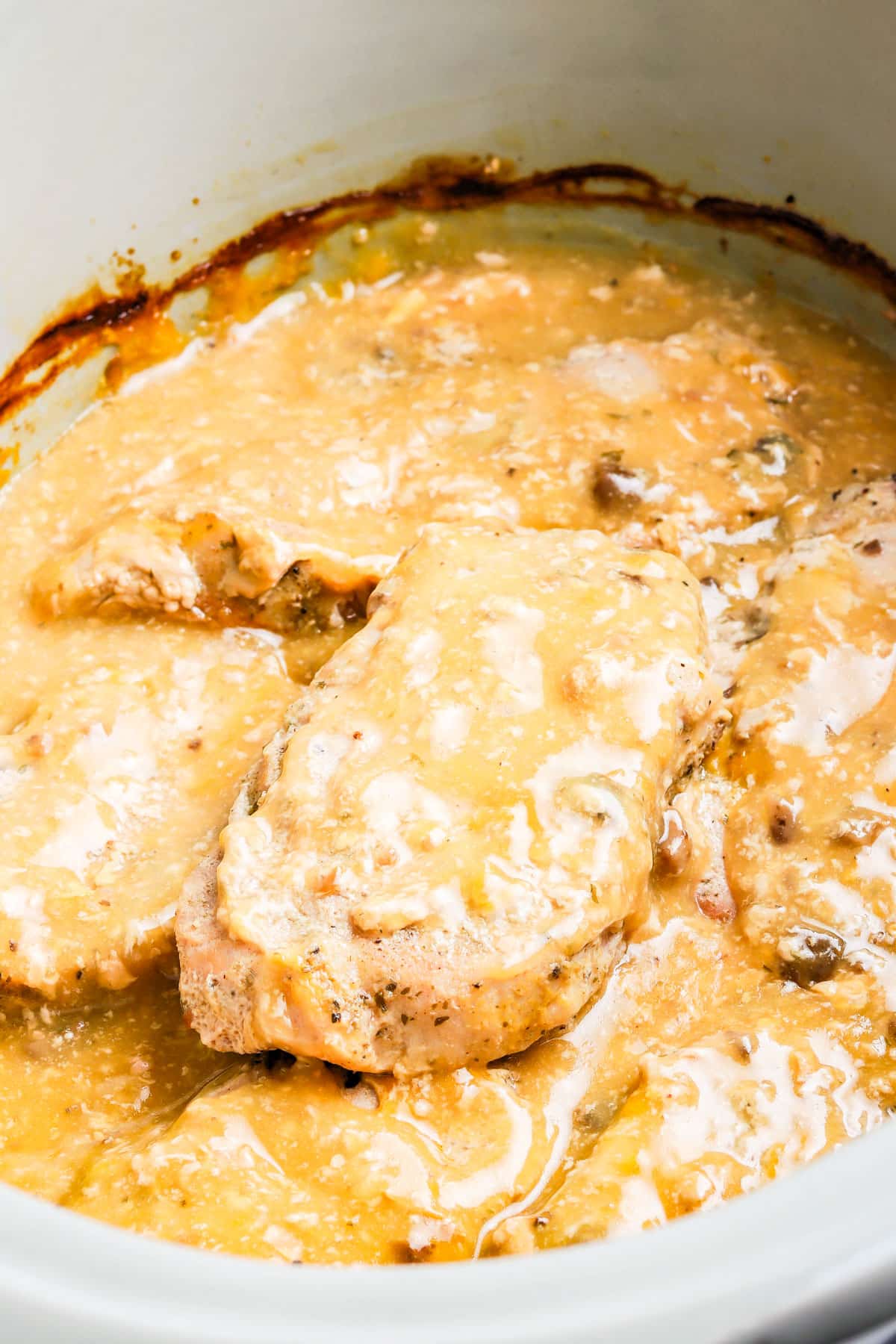 The finished Crockpot Ranch Pork Chops in a slow cooker. 