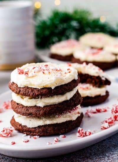 Three Peppermint Chocolate Cookies stacked on a white serving plate.