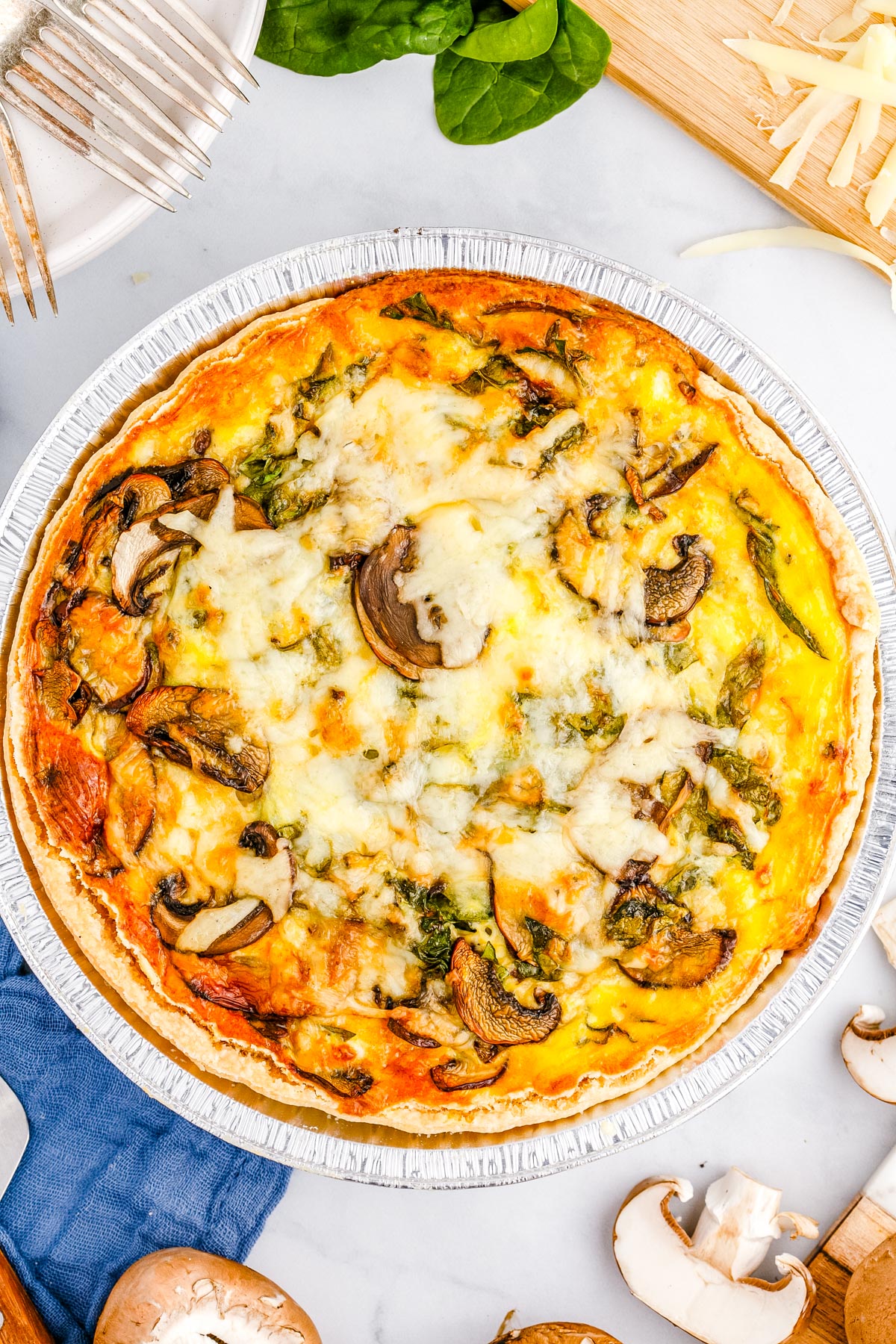 An overhead picture of the finished Spinach Mushroom Quiche. 