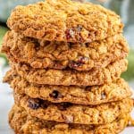 A close up picture of a stack fo these white chocolate oatmeal cranberry cookies.