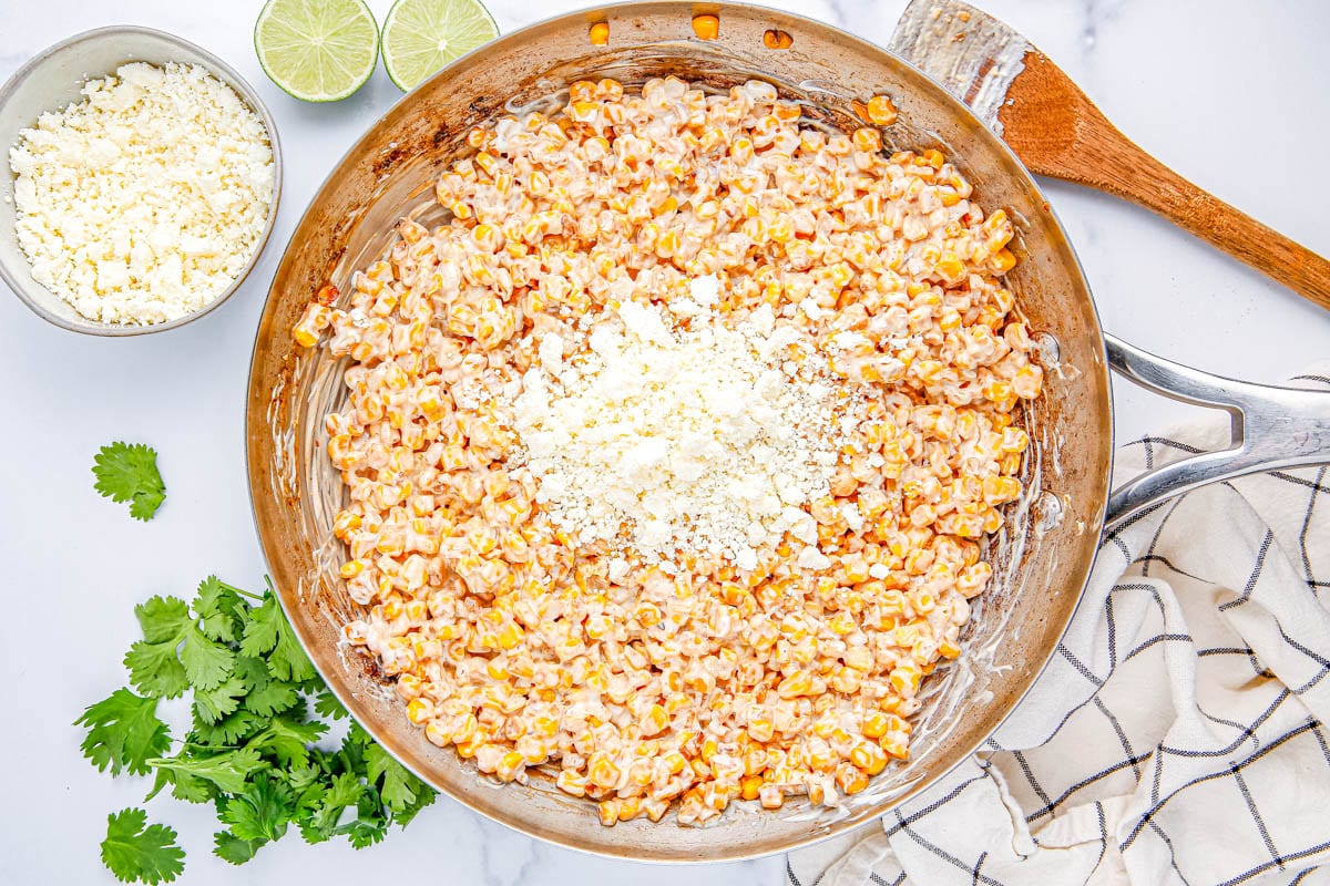 Cheese being added to the dip.